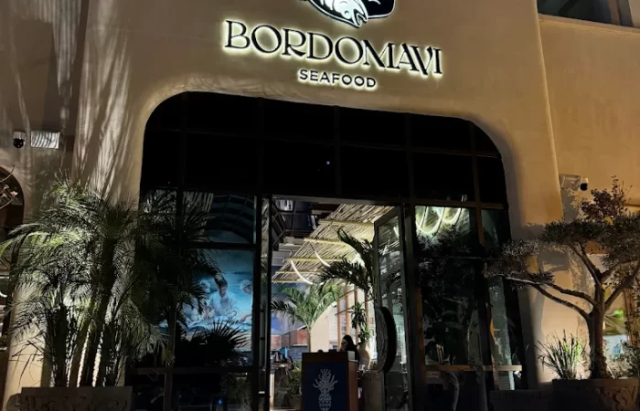 "Collaboration illustration showcasing two designers working together on a render of a luxurious Dubai fit-out project for DWS Interiors, UAE"