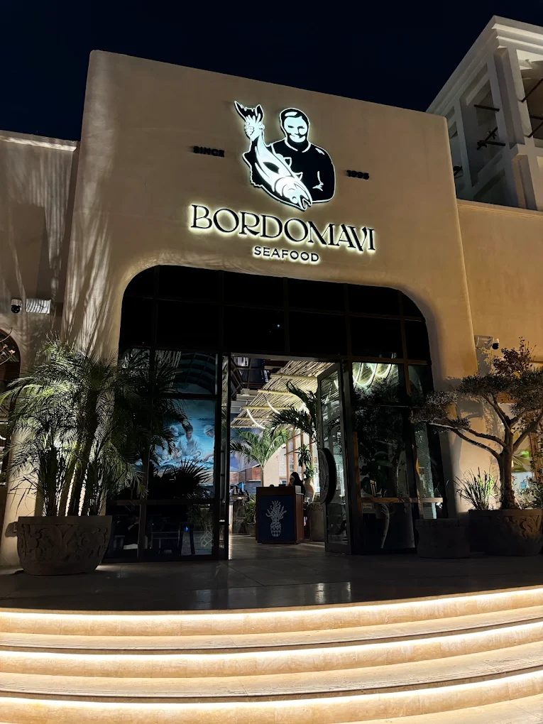 "Collaboration illustration showcasing two designers working together on a render of a luxurious Dubai fit-out project for DWS Interiors, UAE"